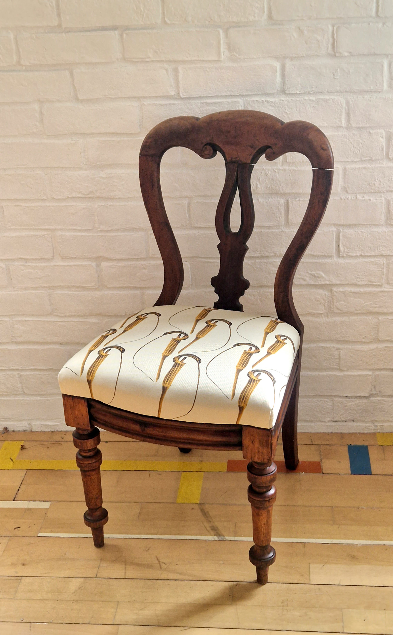 Arisaema cilliatum fabric print on an antique chair by Marianne Hazlewood 