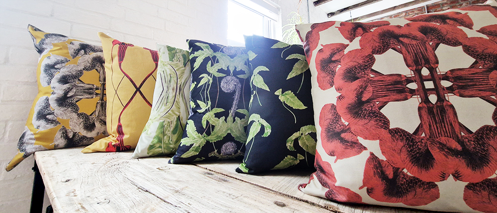 Cushions made with fabric designed by Marianne Hazlewood