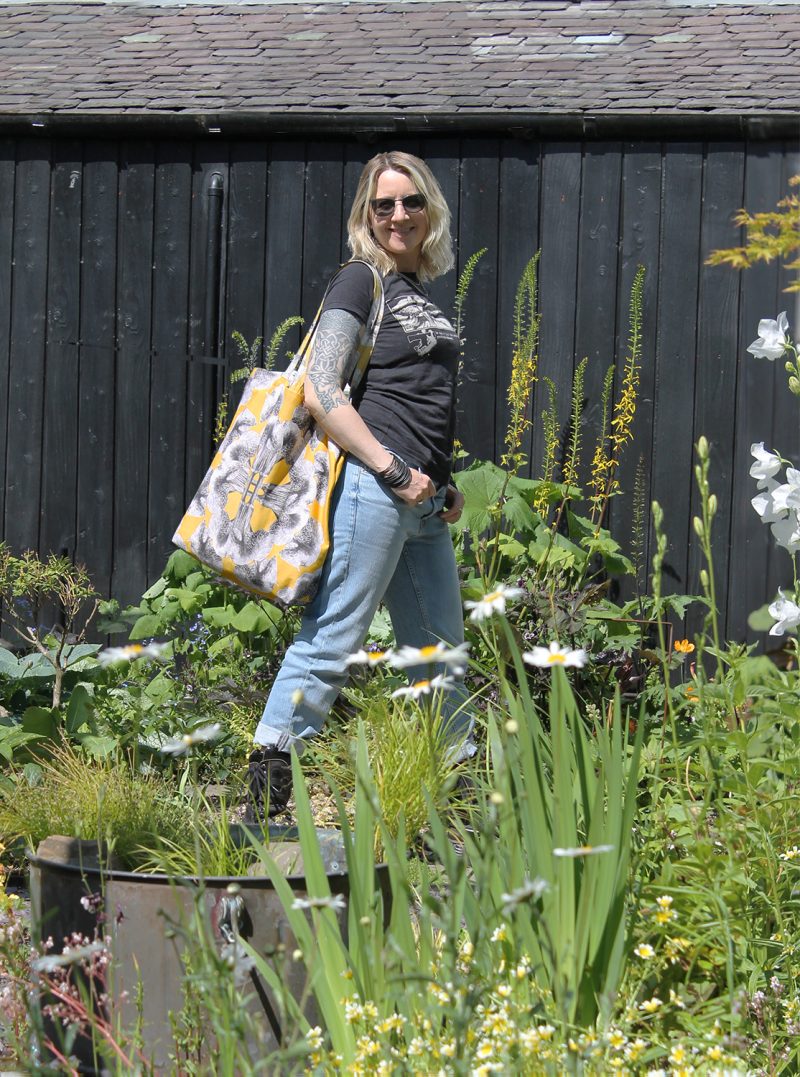 Marianne in the garden with her yellow tote bag - Yellow 50 cm Tote Bag, handcrafted by Kate made in Scotland, designed by Marianne Hazlewood