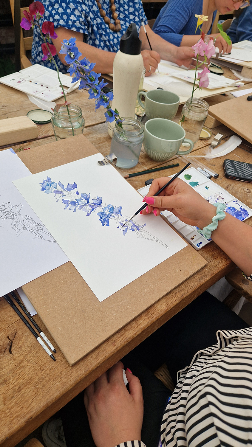 Painting a delphinium at a Botanical art workshop with Marianne Hazlewood